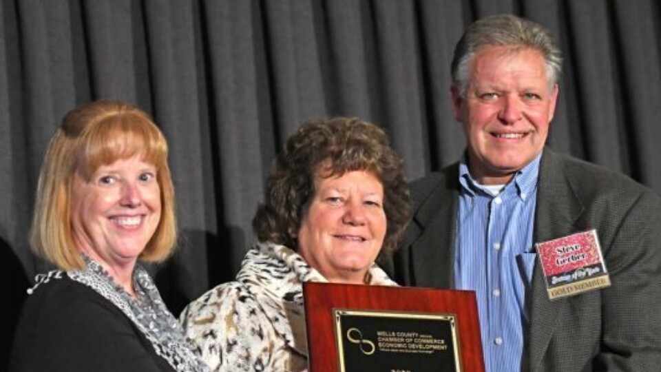 Steve and Gayla Gerber accept the award for business of the year, presented to The ROP Shop's parent company, Outdoor Concepts.