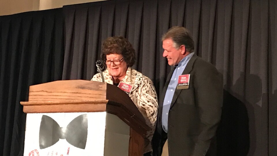Steve and Gayla Gerber accept the award for business of the year, presented to The ROP Shop's parent company, Outdoor Concepts.