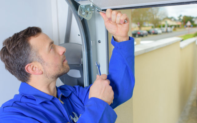 Man repairing a garage door