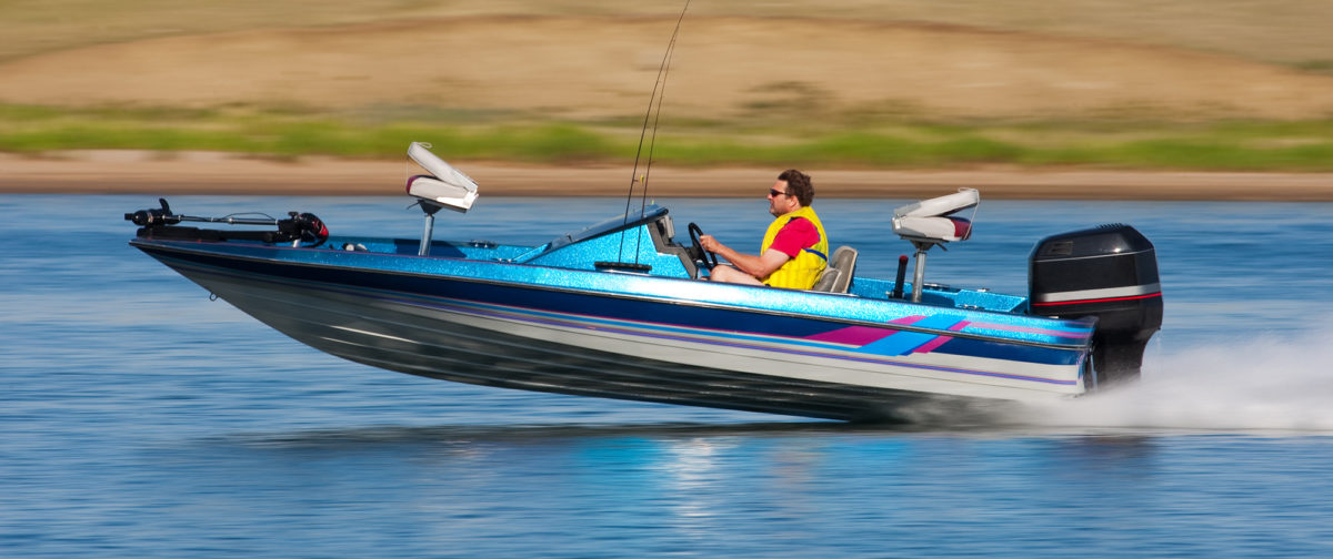 Man enjoying his outboard motor boat