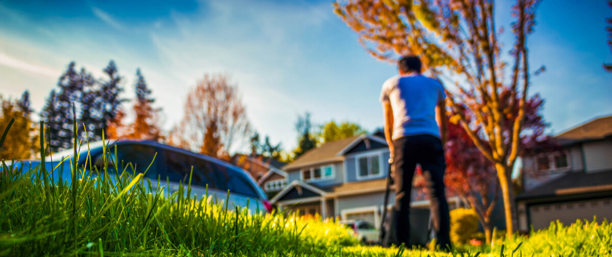 Man mowing his lawn.