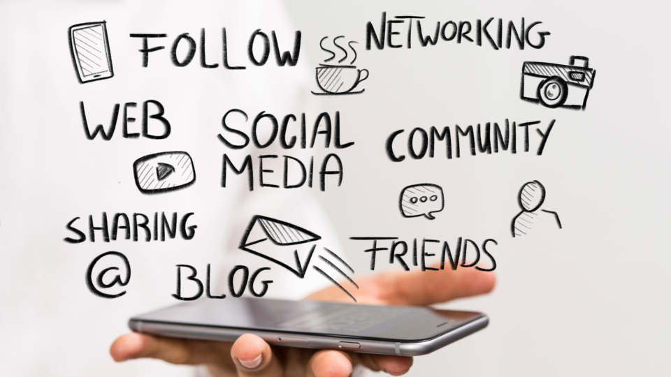 An image showing a person holding a phone with social media-related words hovering over it