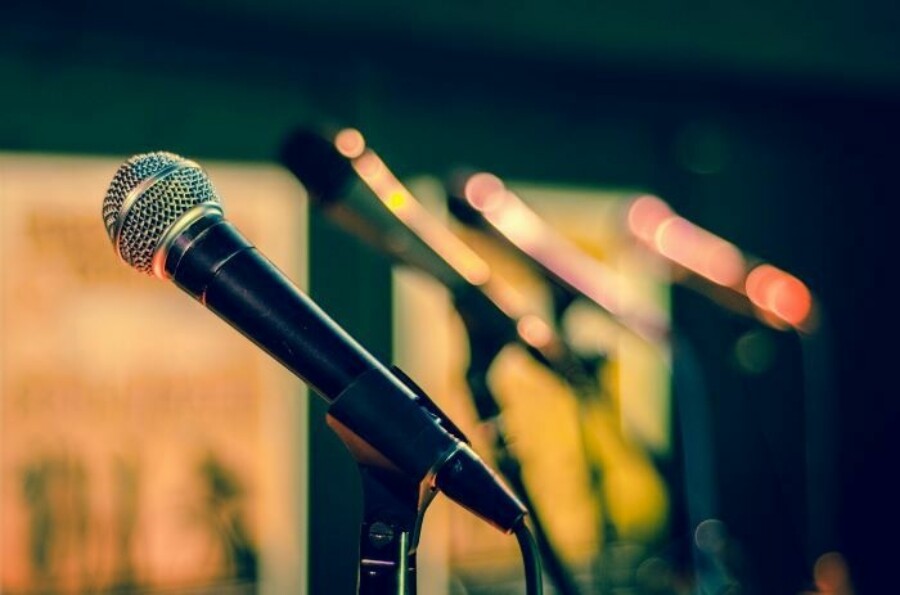 Microphones lined up 700x463