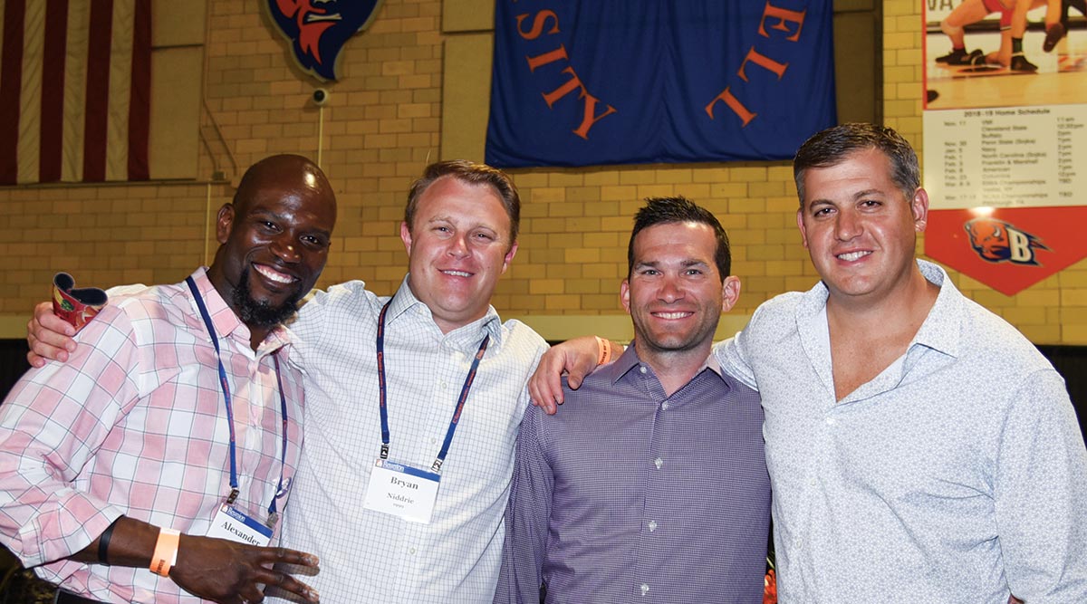 Four fellow winners enjoying the Alumni Awards reception. Fellow winners enjoying the Alumni Awards reception.