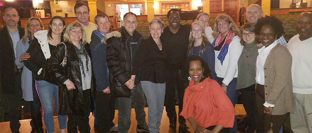 Gbenga Akinnagbe ’00 with alumni after his performance Gbenga Akinnagbe ’00 (center) with alumni after his performance