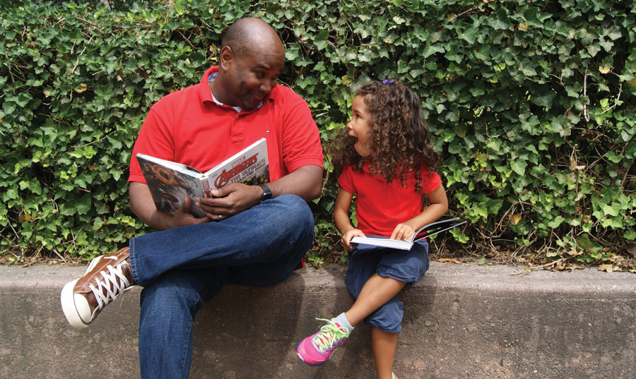 Christopher Persley '95 and his daughter Camilla father and daughter reading together