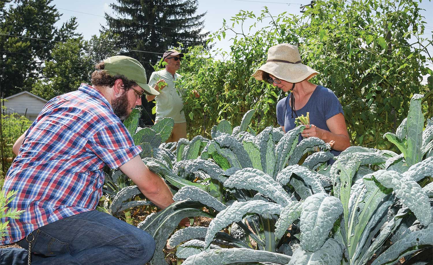 Kyle Bray, Mark Spiro and Jen Schneidman Partica Kyle Bray, Mark Spiro and Jen Schneidman Partica tidy up vegetable beds at the Lewisburg Community Garden.