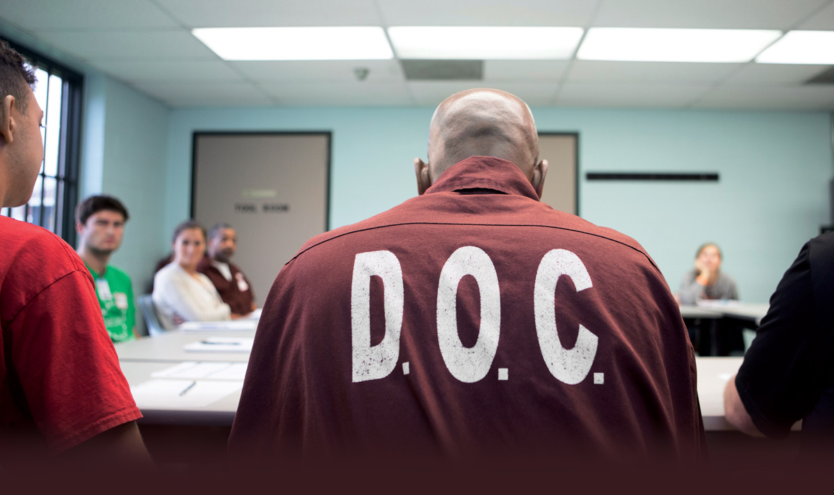 Pedagogy Behind Bars Man wearing D.O.C. uniform