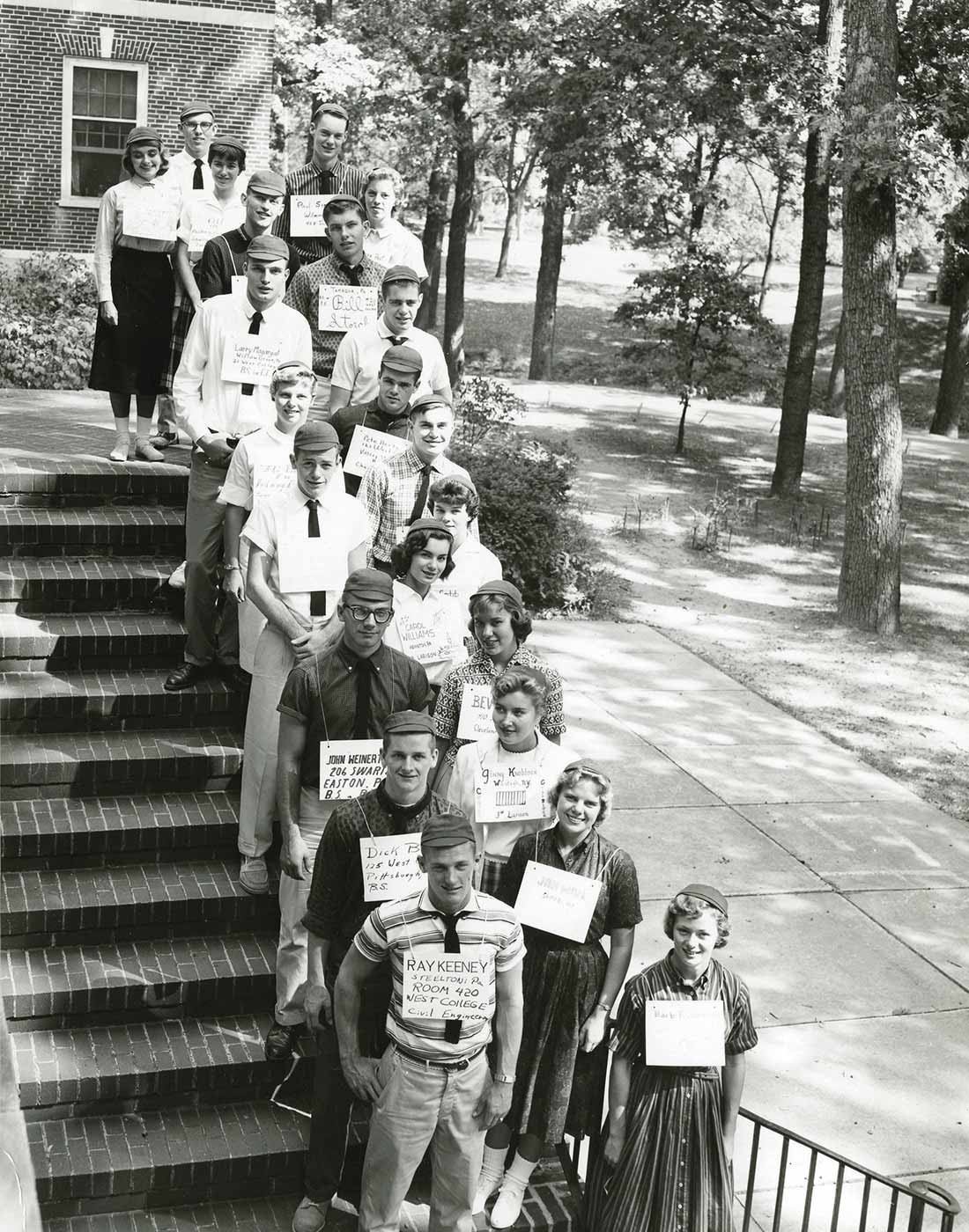 Witty Winners Vintage photograph of Bucknell students lined up on stair with identifying cards around their neck.