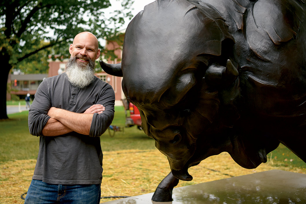 A homecoming dedication Sculptor Craig Campbell with the new bronze mascot
