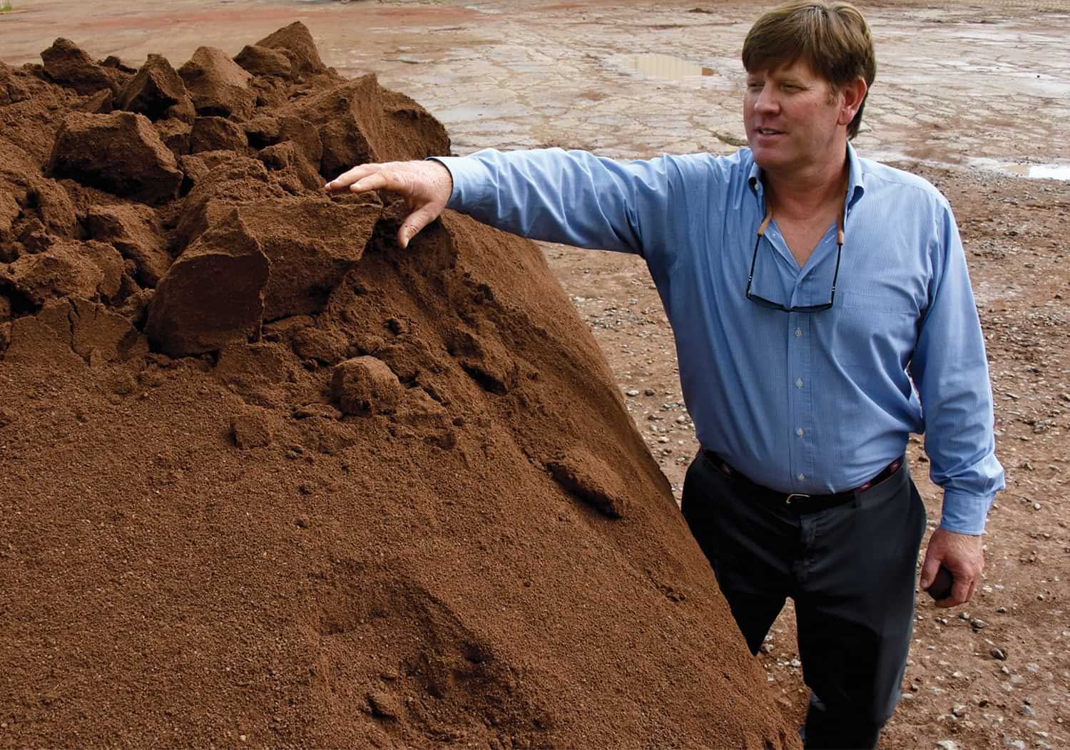 Grant McKnight and his red-clay mix Grant McKnight surveying his red-clay mix at his Grove City, Pa. facility