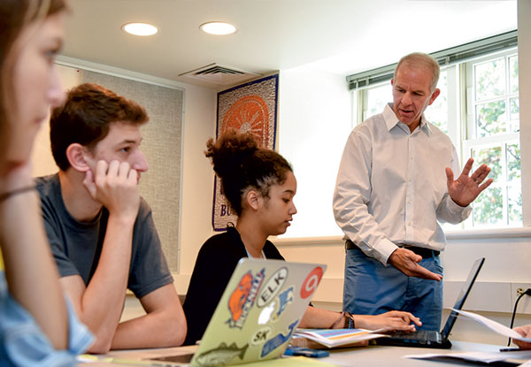Professor teaching students in a Management 101 class this fall