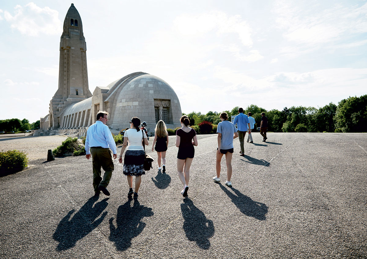 Group walking to the military cemetery and memorial People walking to the military cemetery and memorial
