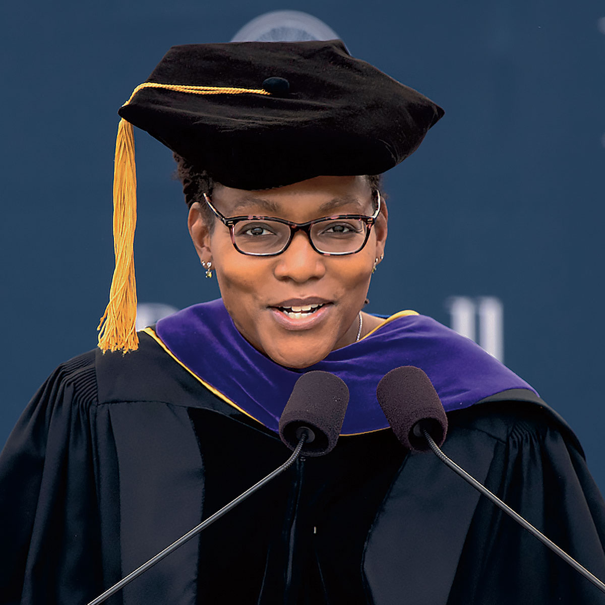 Audra Wilson ’94 Audra Wilson ’94 in a teacher's graduation cap and gown giving her keynote address at Bucknell’s 171st Commencement