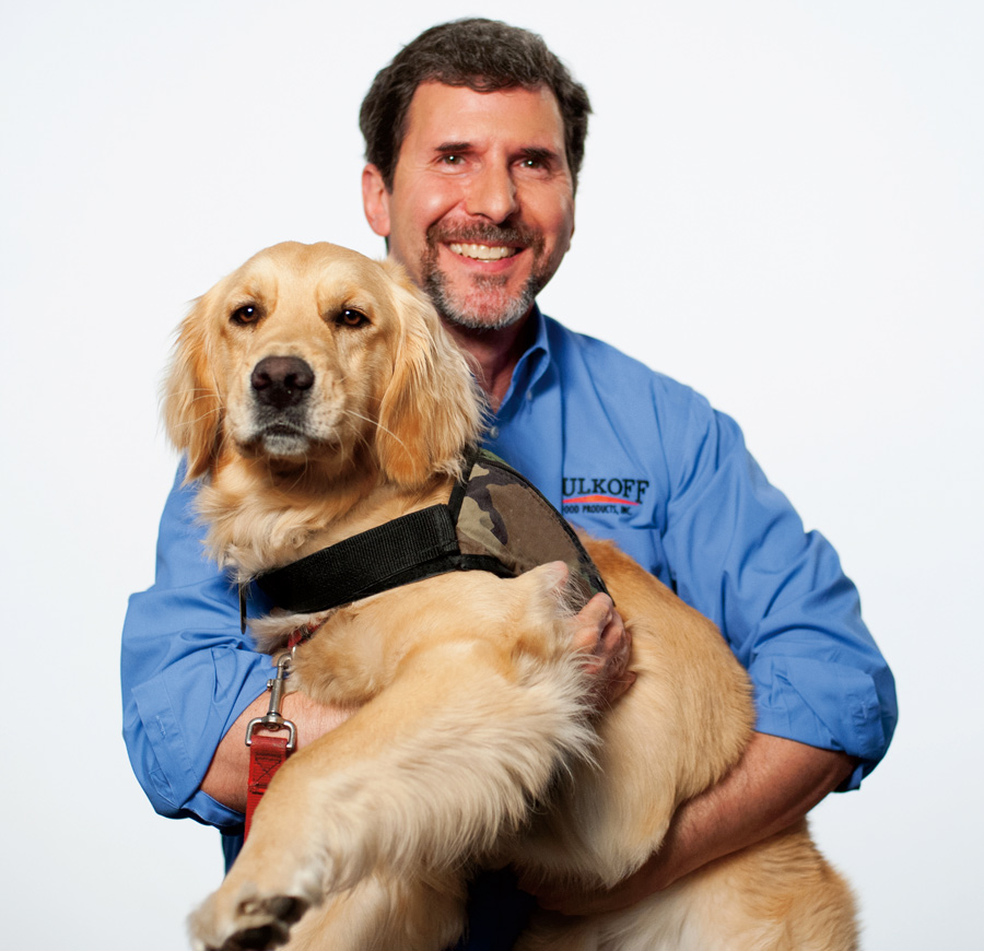 Phil Tulkoff Phil Tulkoff holding a golden retriever