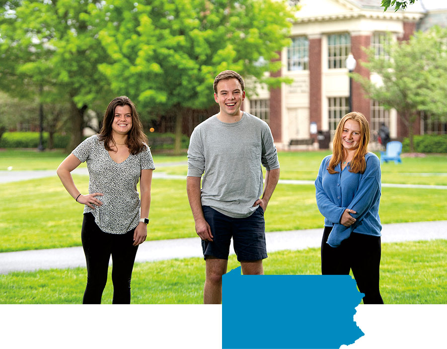 Val LaMore, Paul Danenberg, Callie Sullivan Val LaMore, Paul Danenberg, Callie Sullivan standing on a grassy lawn at Bucknell
