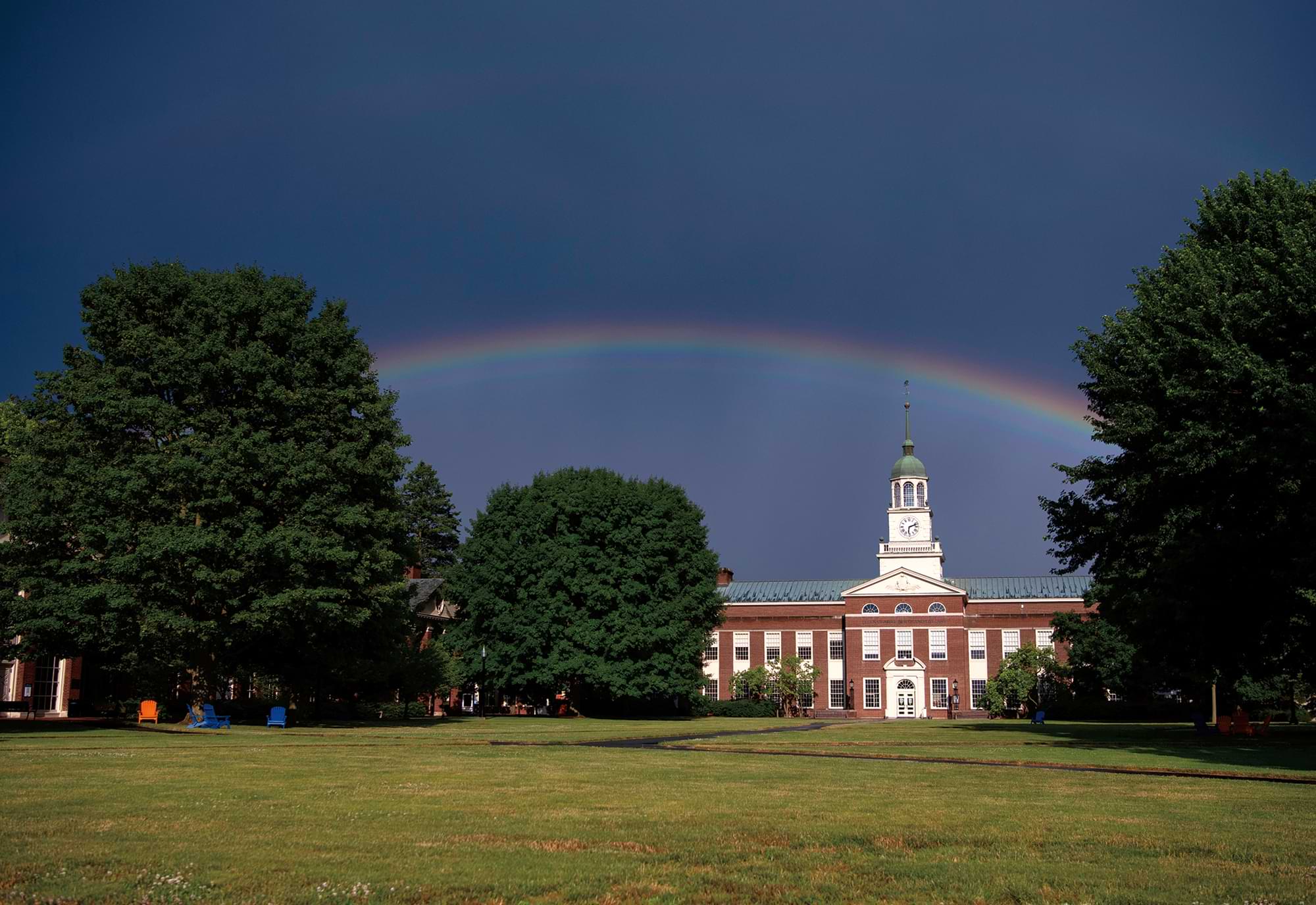 SOMEWHERE UNDER THE RAINBOW a stormy sky showers good luck on the Ellen Clarke Bertrand Library with a rainbow