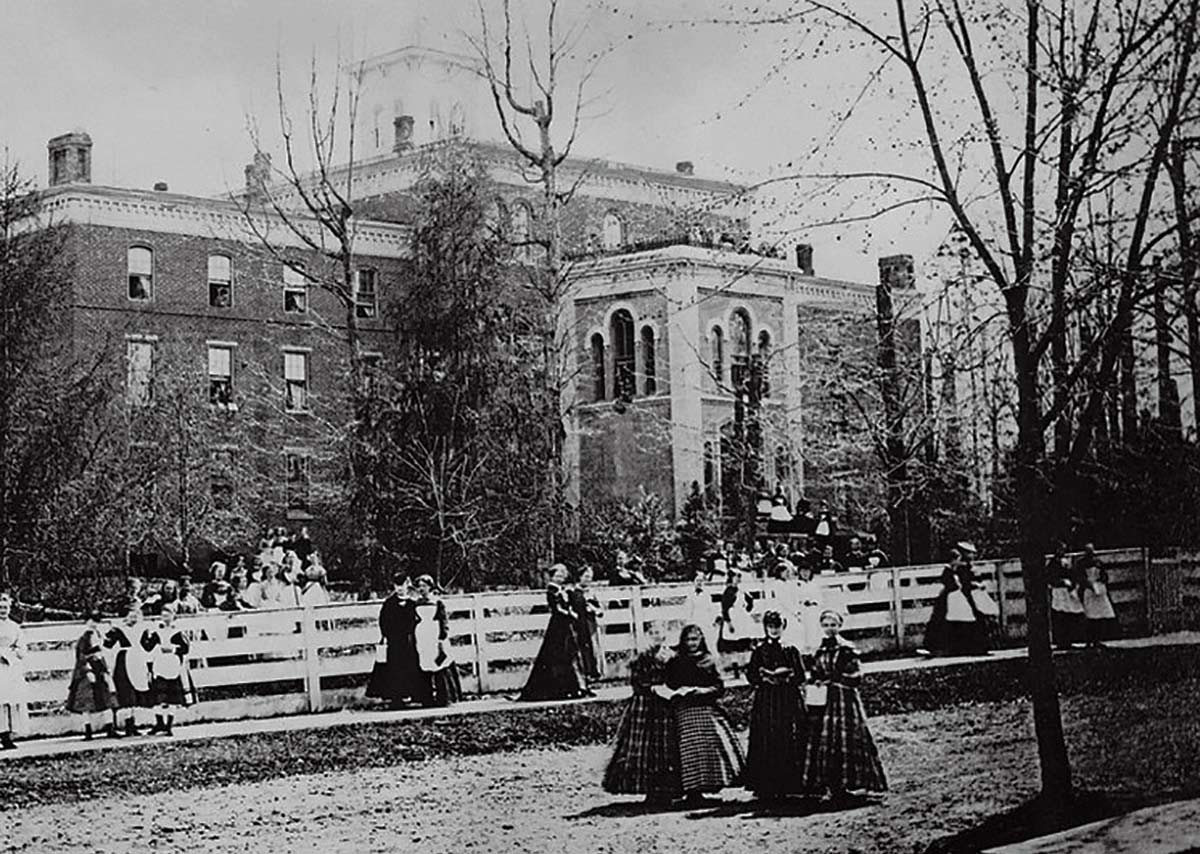 Students walking around the Larison Hall