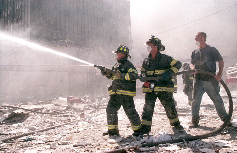 Jeff Hines ’84, wife Patti Stirk and their 19-year-old cat Firefighters battle the World Trade Center blaze after the terrorist attack on Sept. 11, 2001