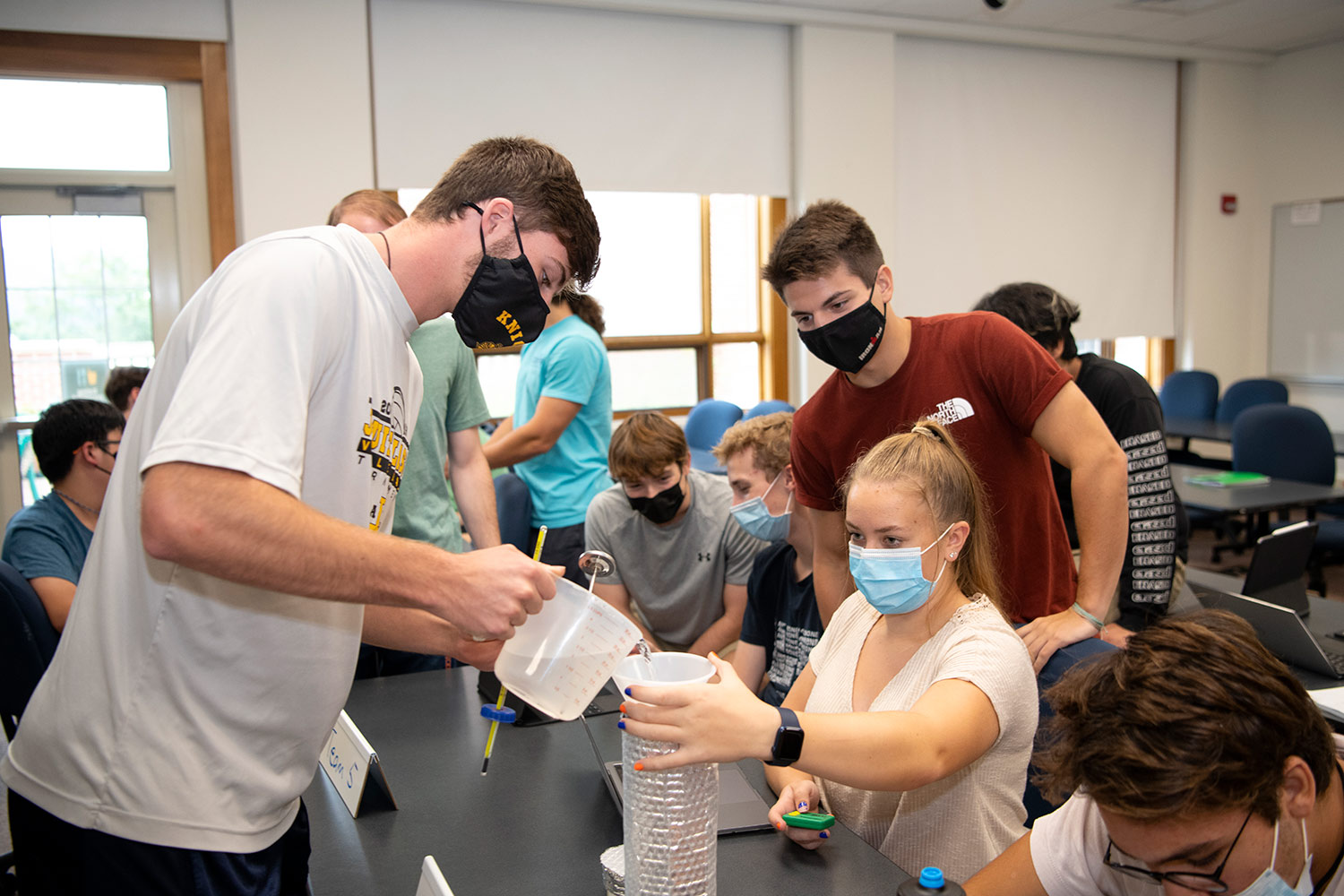 Bucknell students participate in a hands-on, project-oriented assignment within an ENGR 100 course A photograph taken of a student group activity inside a ENGR 100 course at the Bucknell College of Engineering building