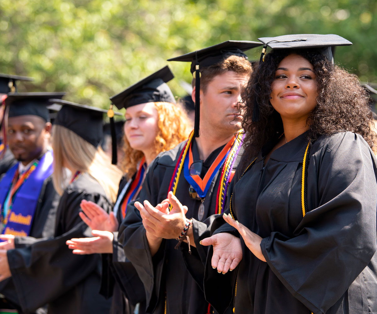 Graduates clapping
