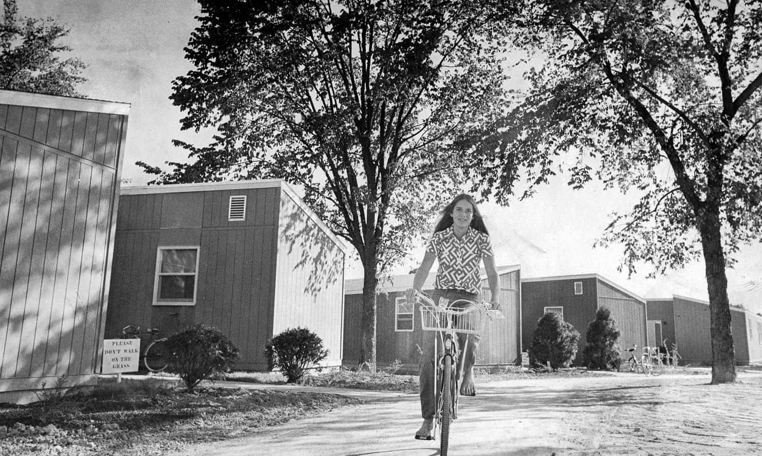 Ride the Rails black and white photo of a young girl riding a bike