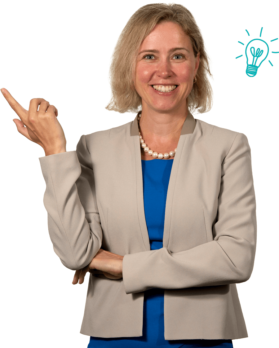 Kate Suslava in a tan jacket and blue dress, smiling pointing to her right