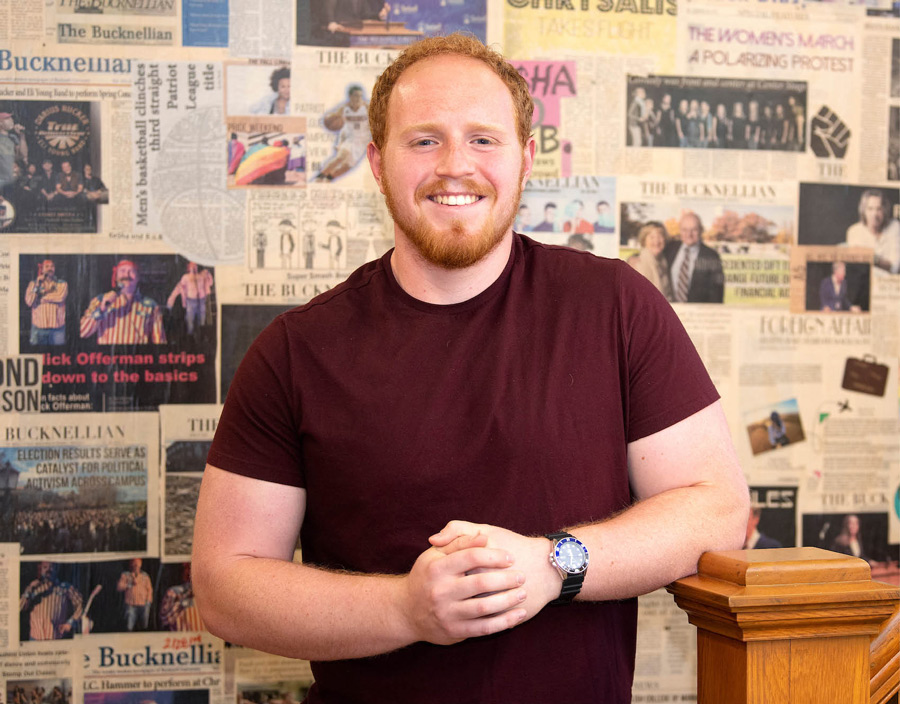 Jaxon White smiling, wearing a red shirt