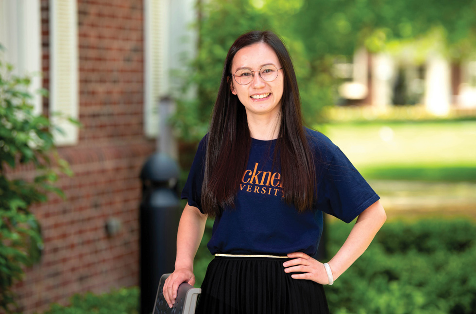 Bangyan Li smiling in a blue Bucknell shirt