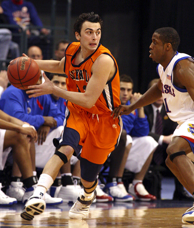 John Griffin playing basketball on the court
