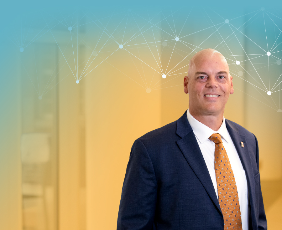 Brad Putman in suit smiling