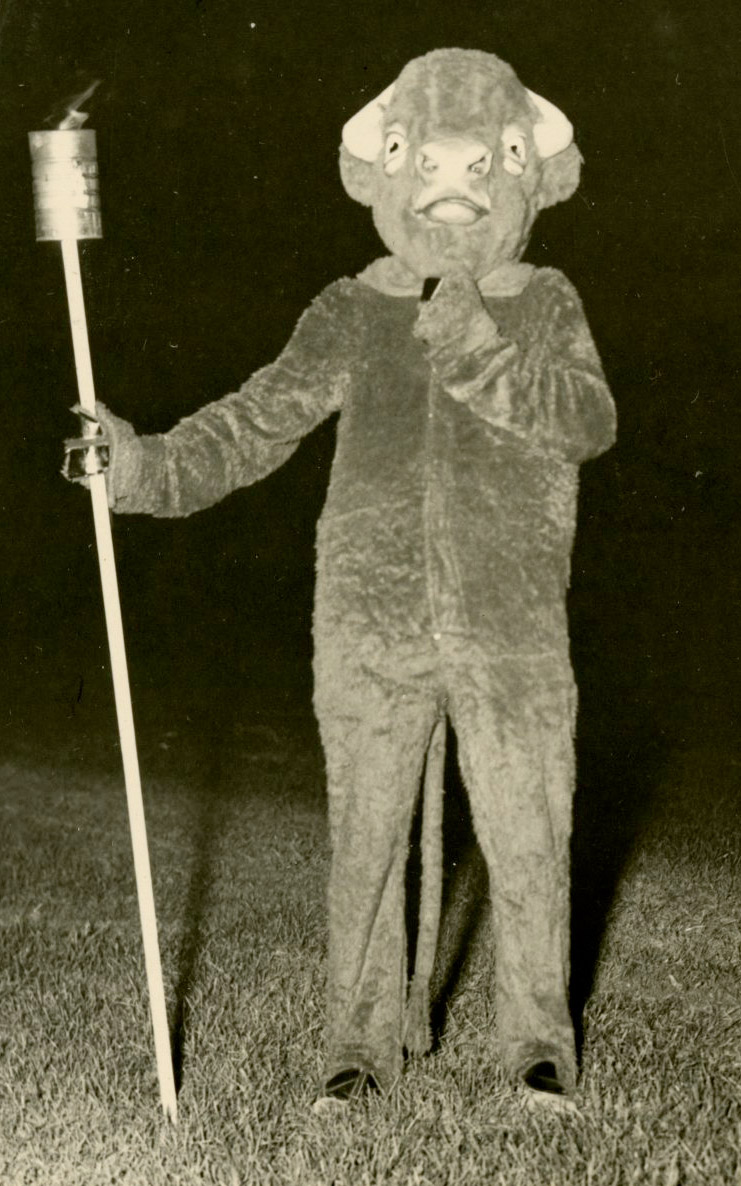 Old photo of a student posing in the first Bucky costume