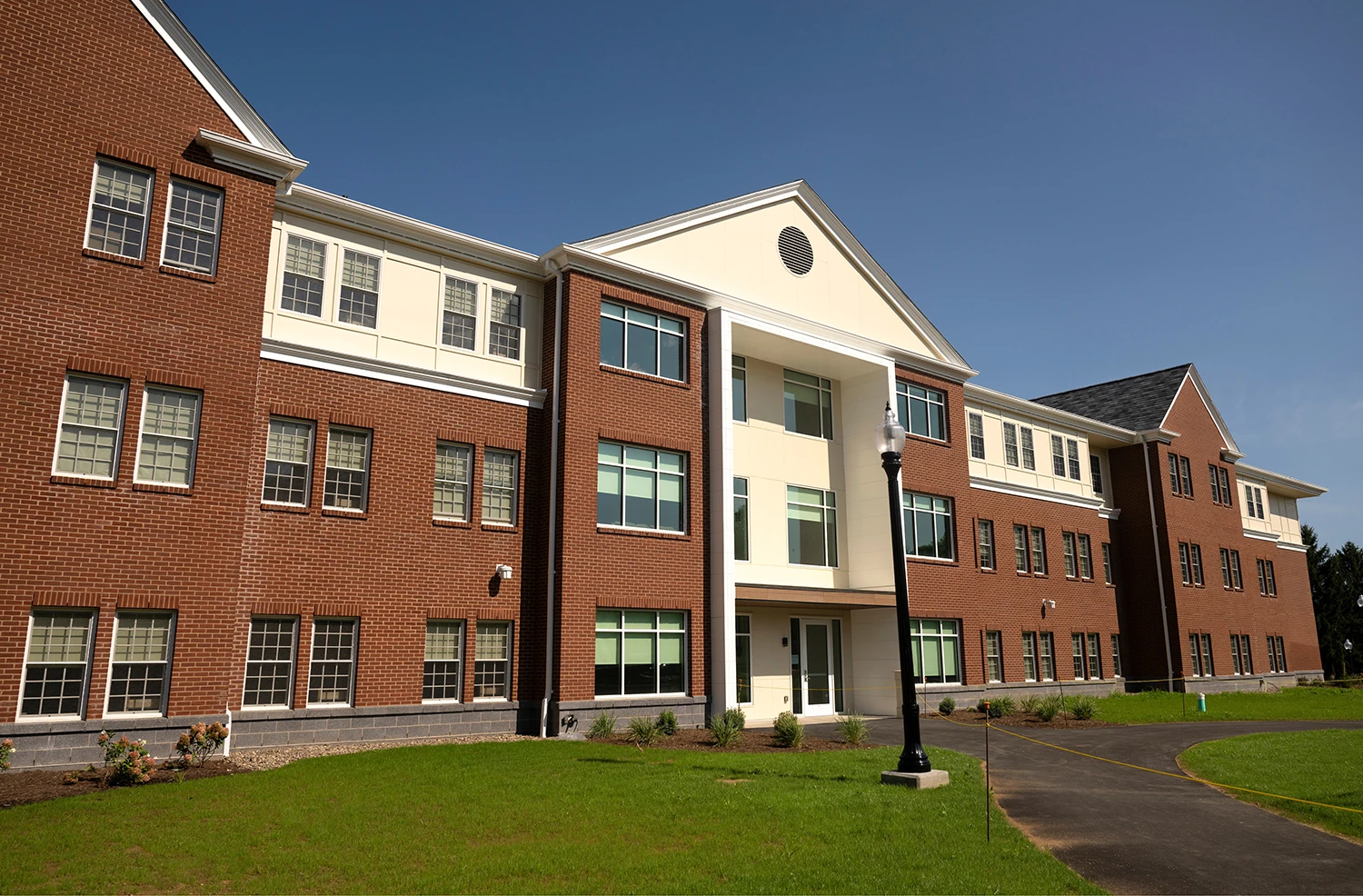 exterior view of brick and white building