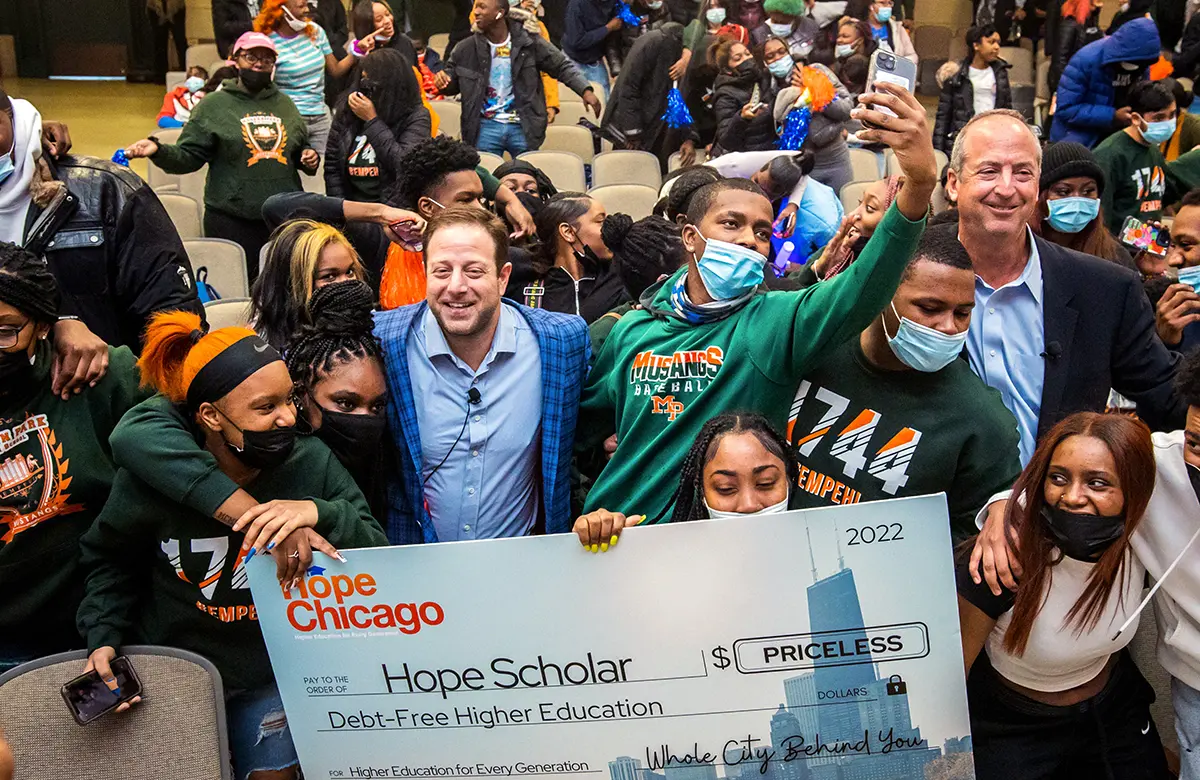 group of people holding a large check from Hope Scholar