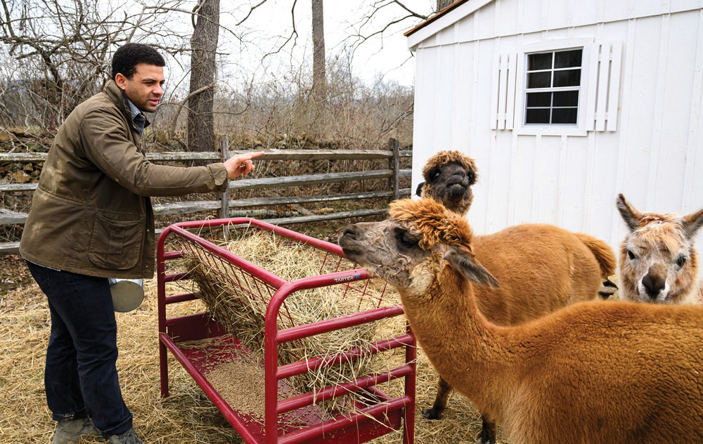 Sam Nana-Sinkam with animals on a farm