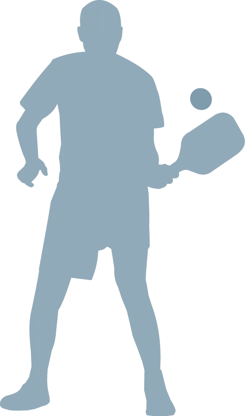 silhouette of a man playing pickleball