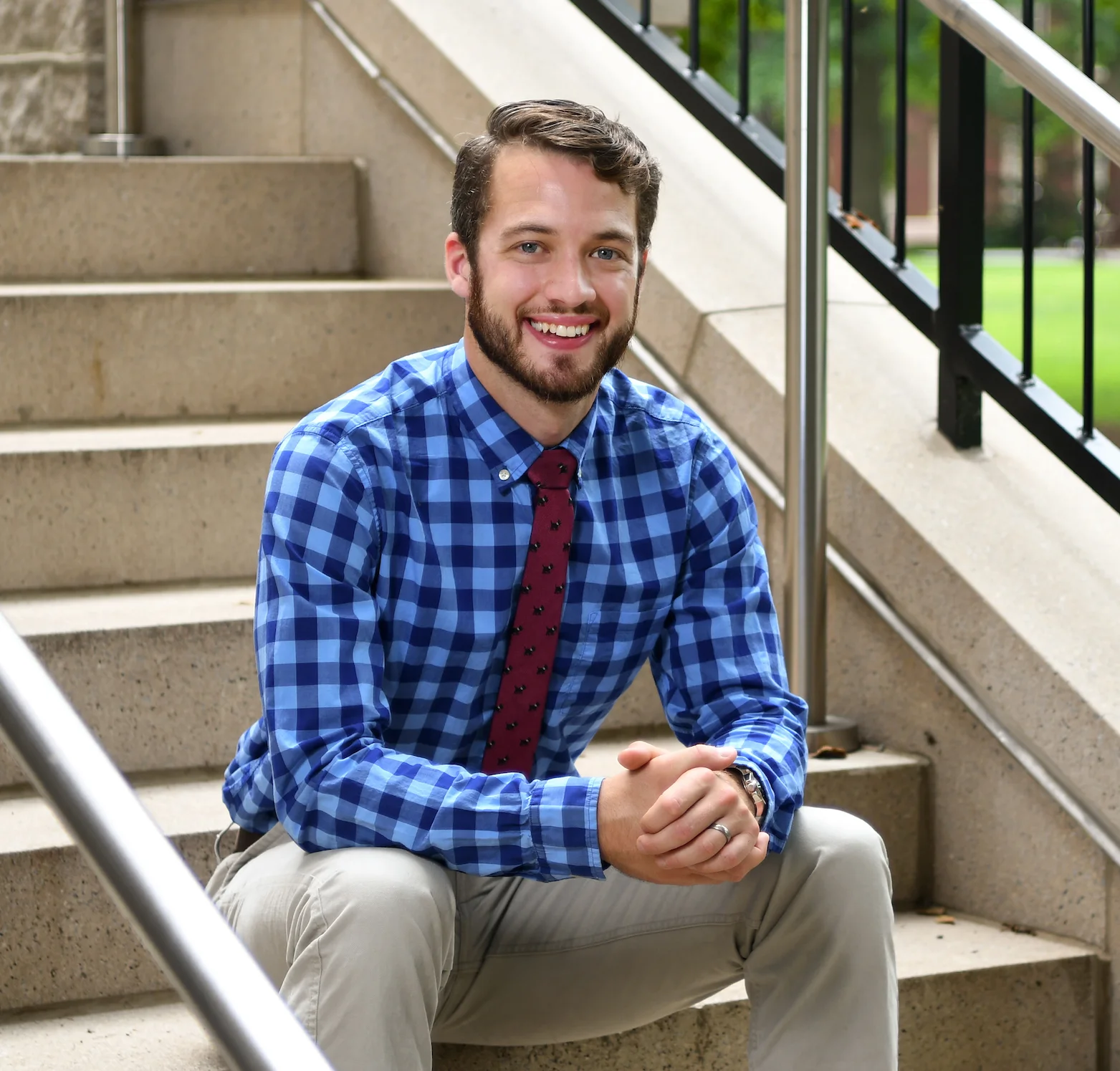 Benjamin Wheatley sitting on stairs while smiling