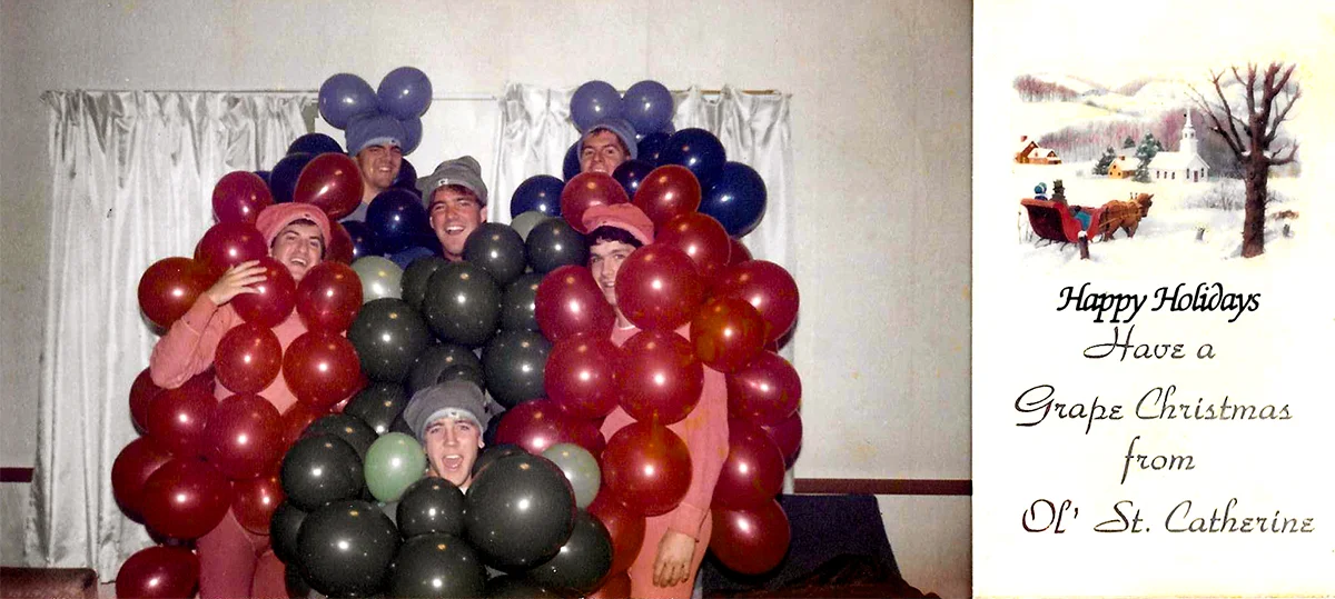 Christmas card featuring a photo of Chris Baker, Michael Gamboli, Reid Leslie, Trupe Ortlieb, Scott Yeager, and John Westrum wearing homemade grapes costumes