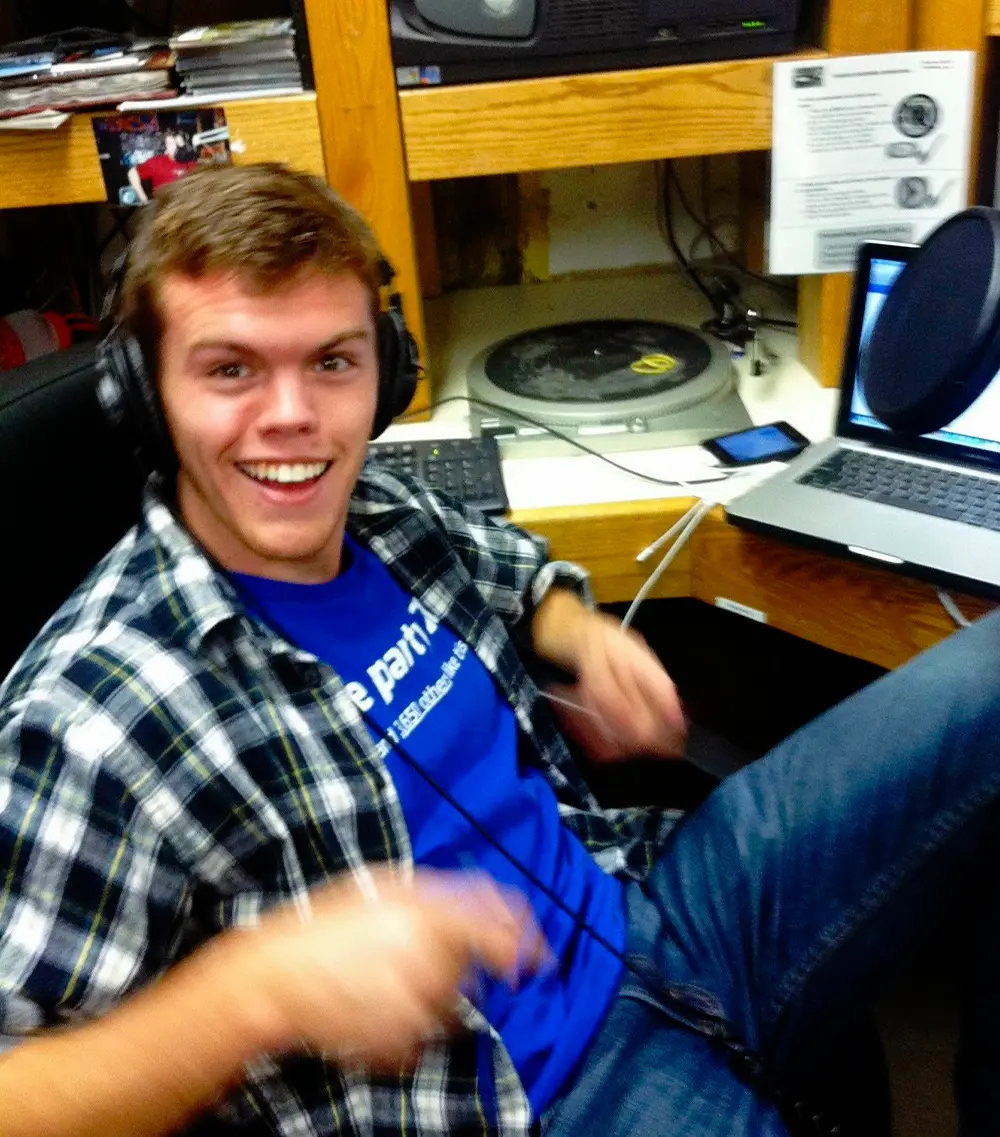 Tom Murphy ’17 smiling while DJ’ing in 2013
