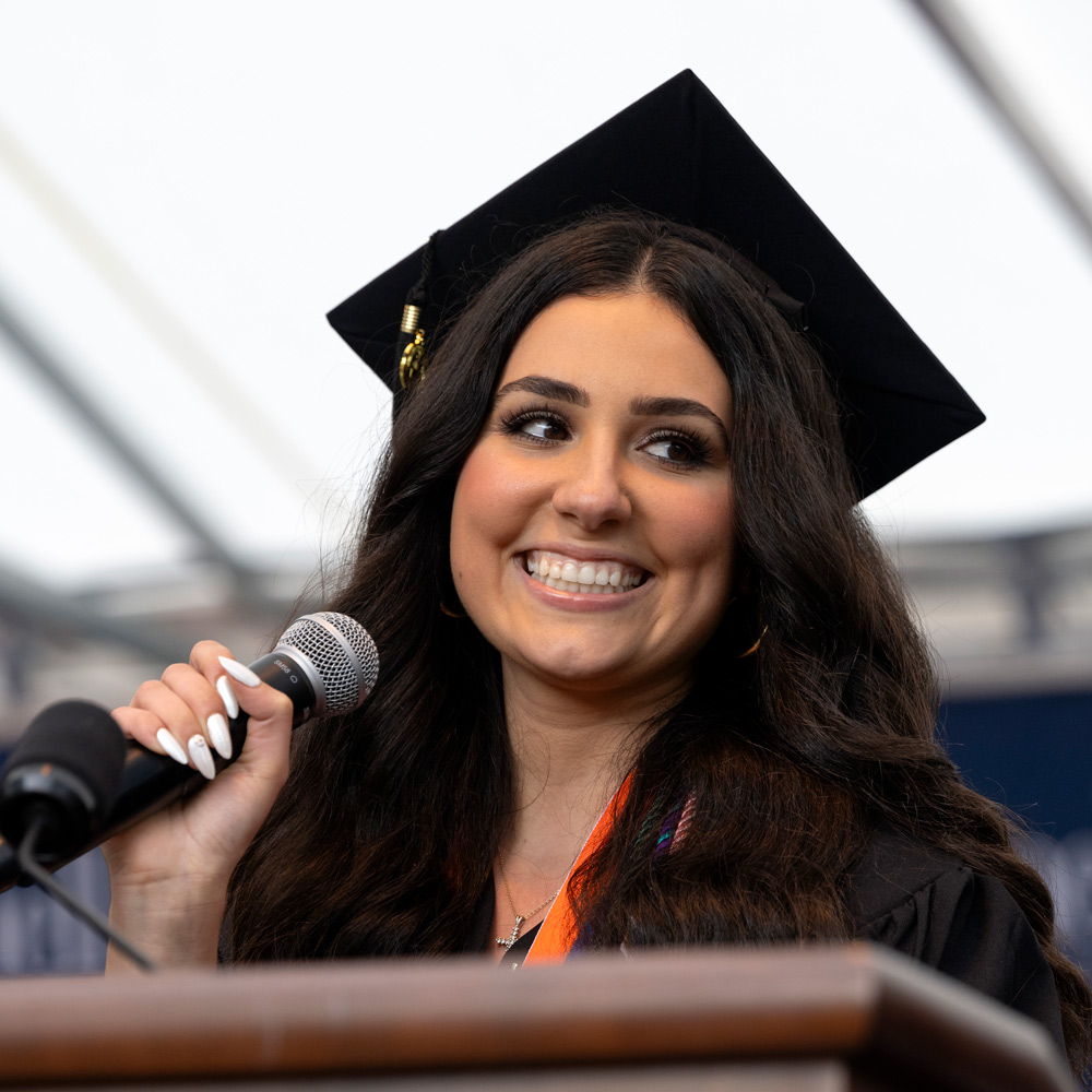 Alexandra Slofkiss preparing to sing the national anthem at graduation