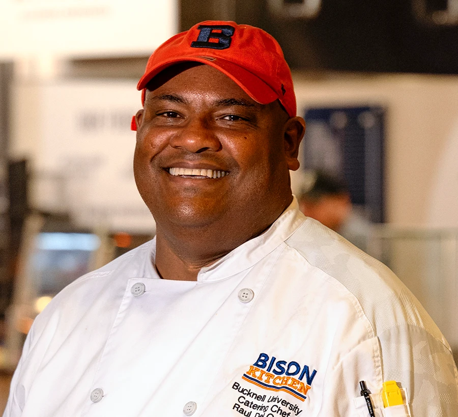 Raul del Orbe smiling in a campus kitchen