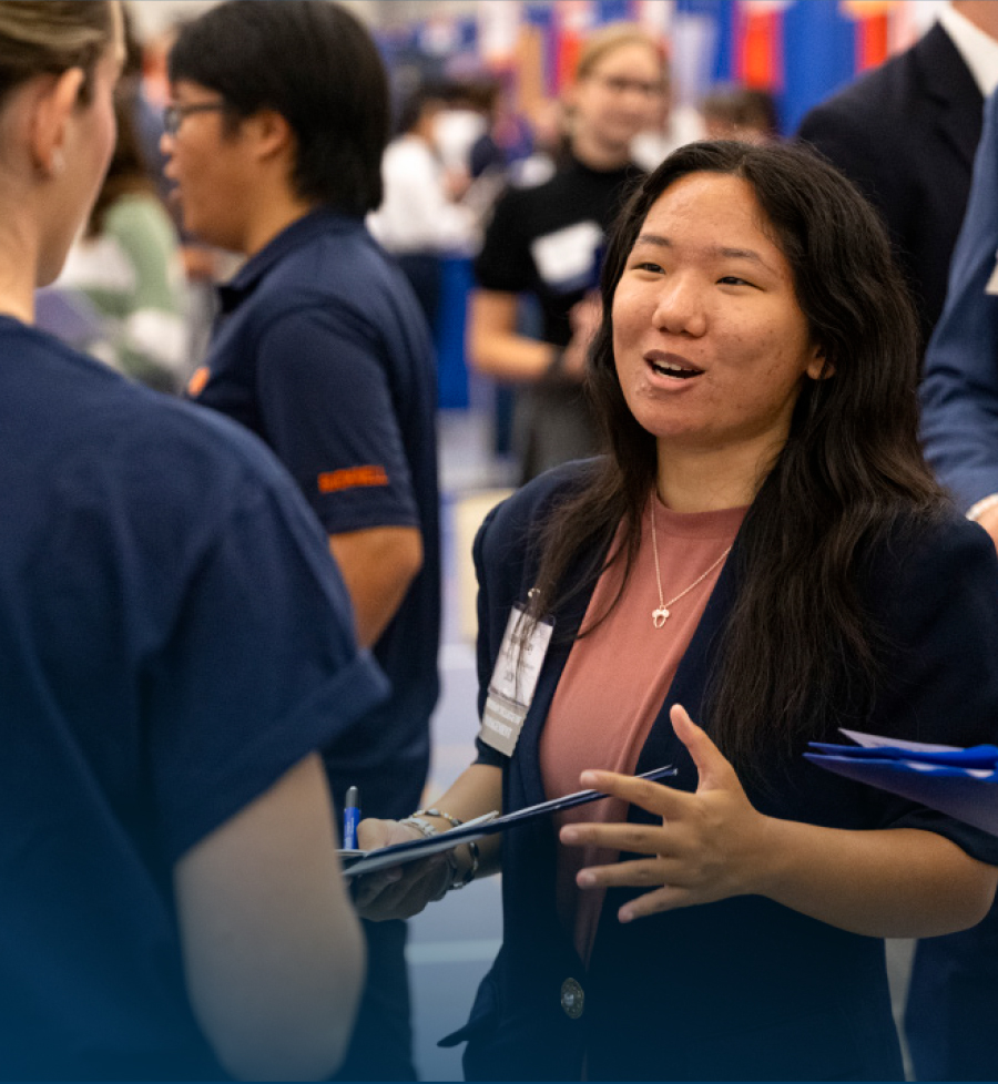 female student talking to male classmate during JumpStart Your Career course