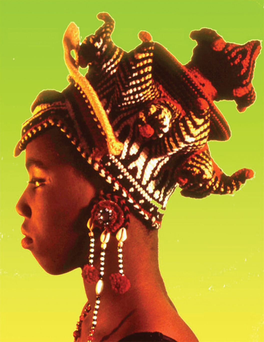 1236 A woman is shown in profile wearing a crocheted hat with many different forms projecting from a complexly shaped base. The yarn is mostly black, white, yellow, and red and creates different patterns. The background of the image is bright green and yellow.