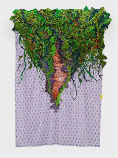 A latex painting on a patterned sheet with a yellow tag. The pattern is dark purple diamonds on a lilac ground. The triangular painting is shades of bright green, evoking vegetation, and the composition is split down the middle.