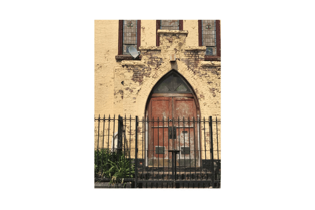 Color photograph of the exterior of a stone building.