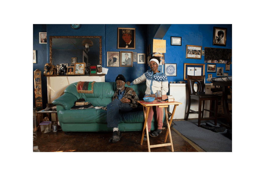 Color photograph of a couple at home.