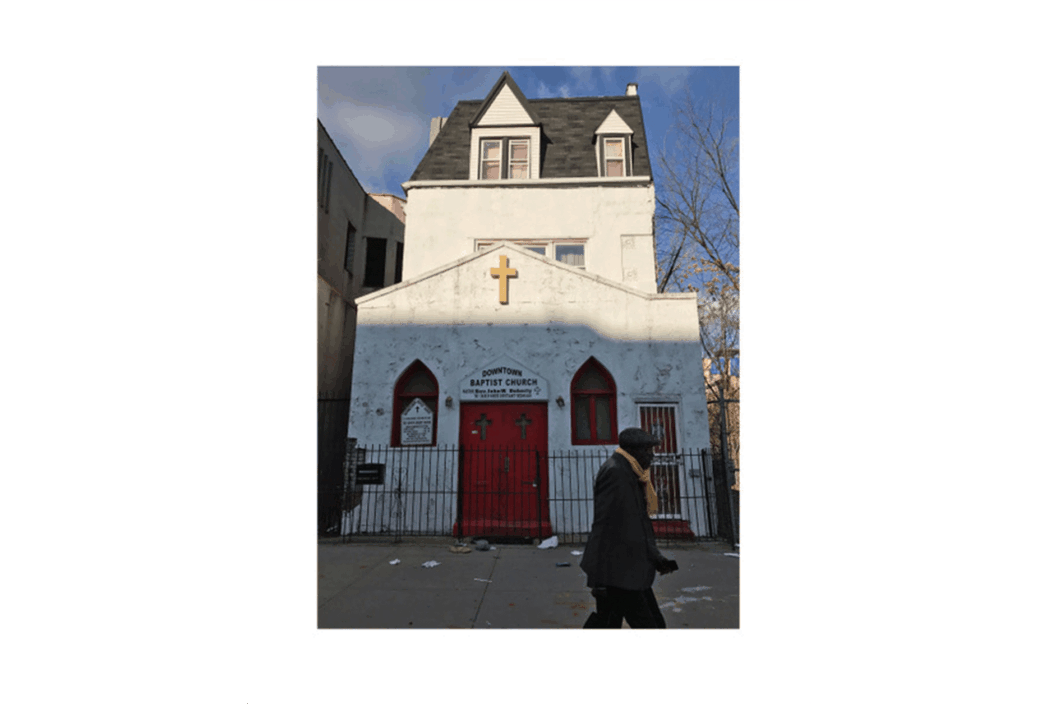 Color photograph of a white church.