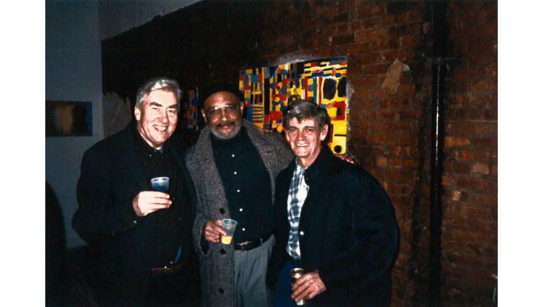 A photograph of Peter Pinchbeck, Danny Johnson, and Thornton Willis standing in a gallery in 2002.