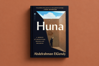 A hardcover mockup of Abdelrahman ElGendy’s Huna, featuring a dark architectural scene opening onto blue sky, set against a warm terracotta background.