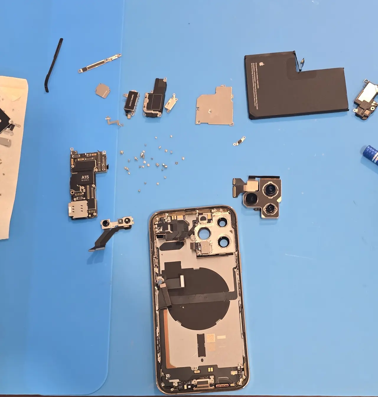 iPhone taken apart on the repair bench